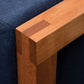 Detail of Celilo Lounge Chair arm in Cherry
