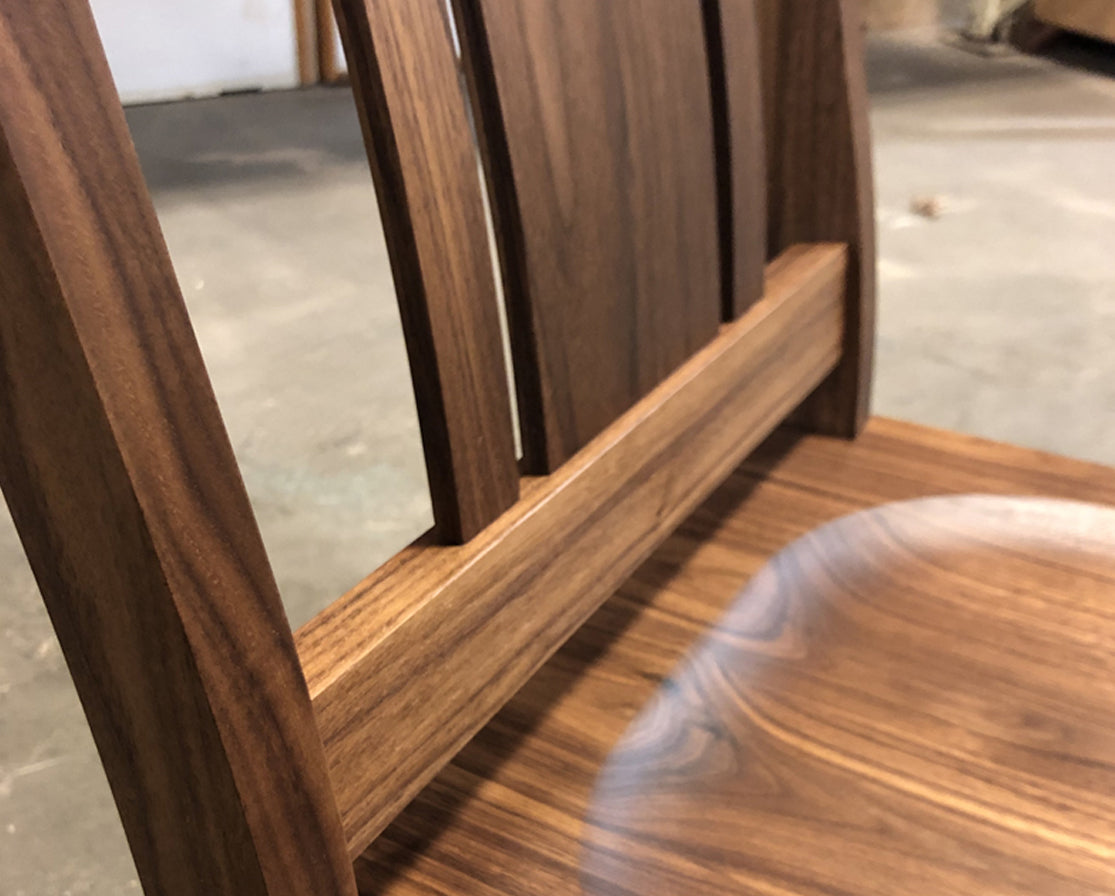 Kenton chair detail in Eastern Walnut with wood seat