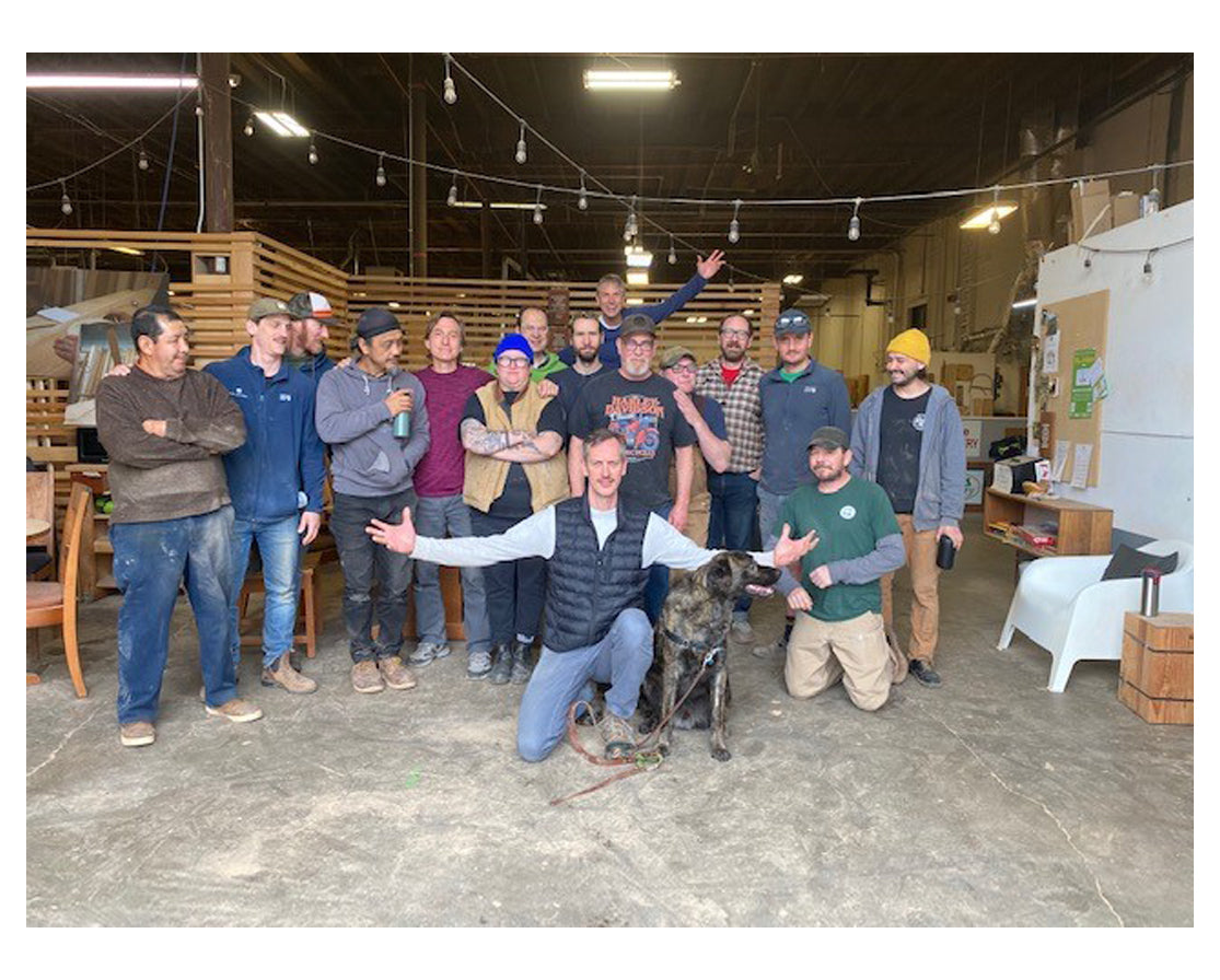 A photo of Kelly and the shop team during Kelly last week of work.