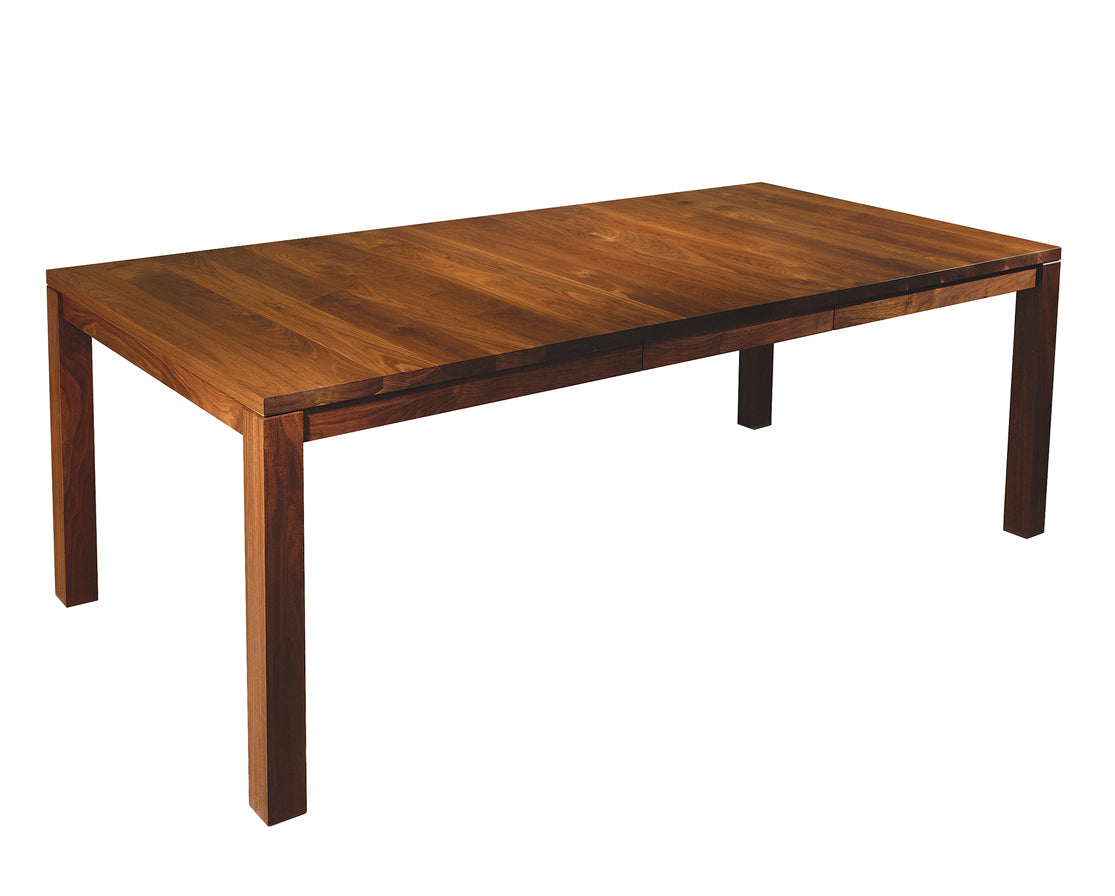 Studio Dining Table in Eastern Walnut, shown with One Leaf