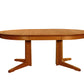 Contemporary Round Pedestal Dining Table in Cherry, shown with one leaf