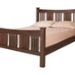 A traditional bed with slats and panels made with dark Walnut wood frame and headboard, dressed in white bedding and two white pillows, shown against a plain white background.