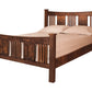 A traditional bed with slats and panels made with dark Walnut wood frame and headboard, dressed in white bedding and two white pillows, shown against a plain white background.