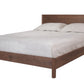A modern platform bed frame in dark brown wood, shown with light gray bedding and two pillows against a plain white background.