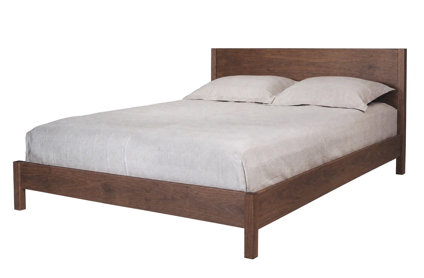 A modern platform bed frame in dark brown wood, shown with light gray bedding and two pillows against a plain white background.