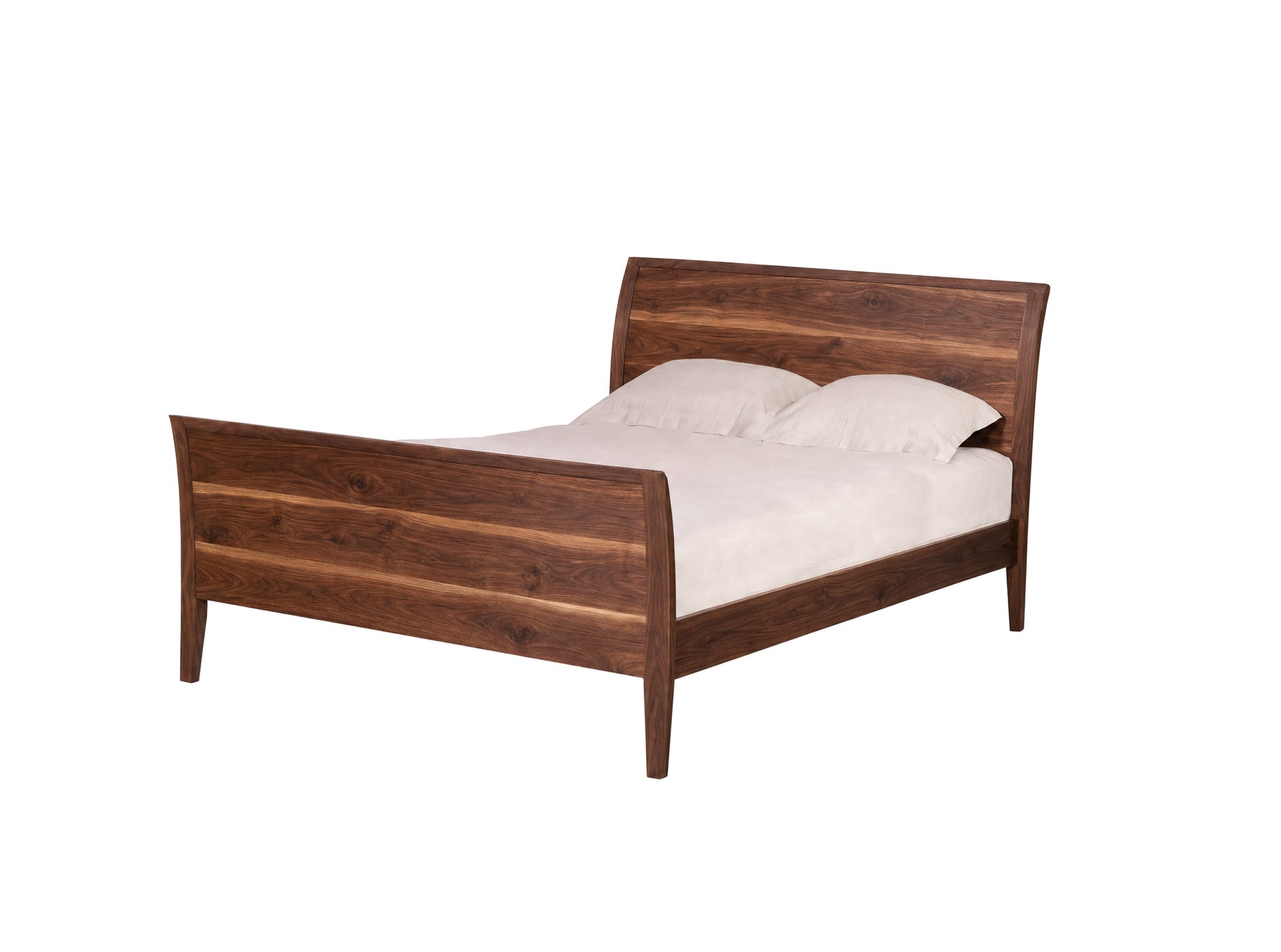 A dark Walnut wood bed frame with a curved headboard and footboard, shown with white bedding and two pillows against a solid white background.