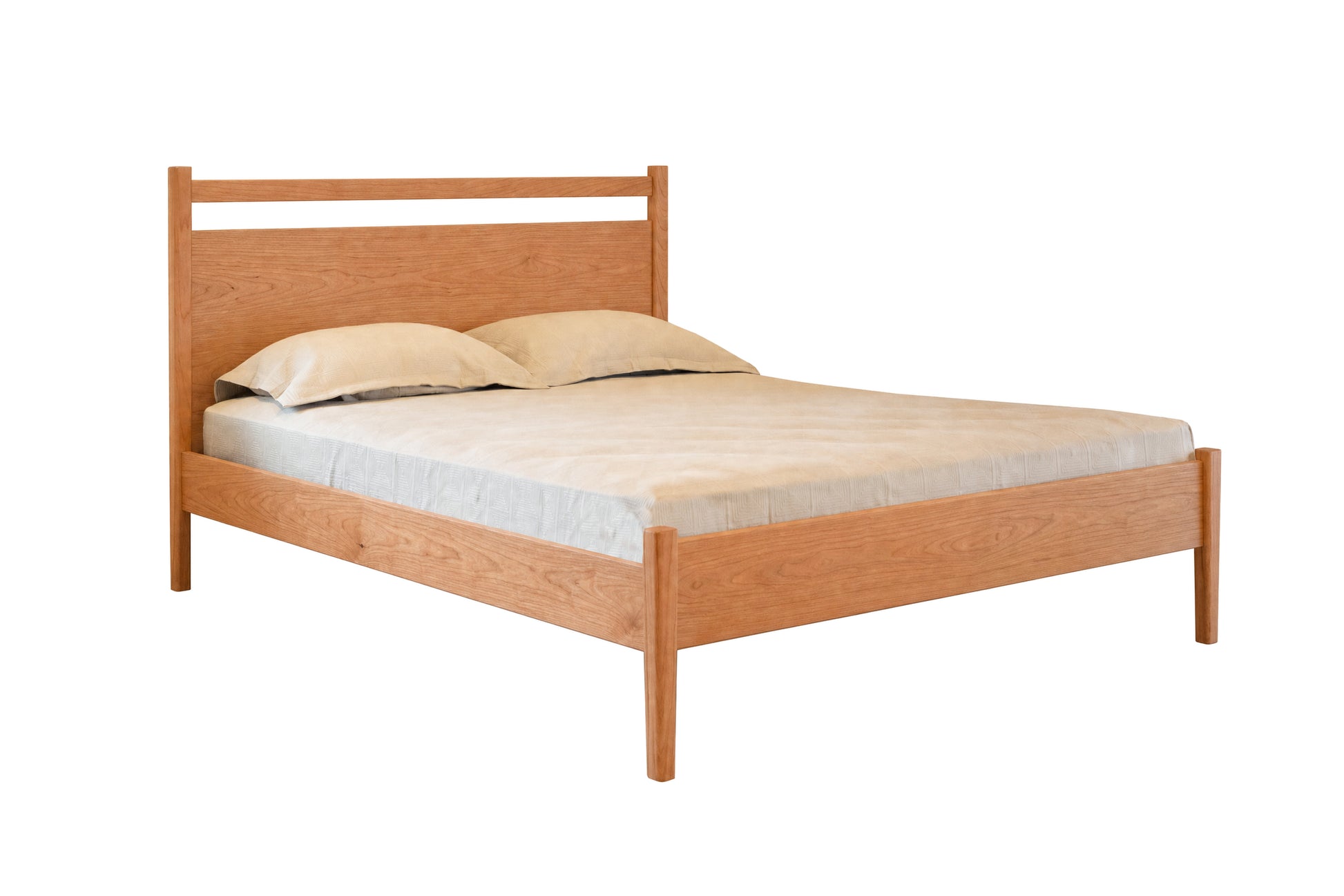 A light Cherry wood bed frame with a slatted headboard and footboard, shown with a mattress and two pillows on a solid white background.