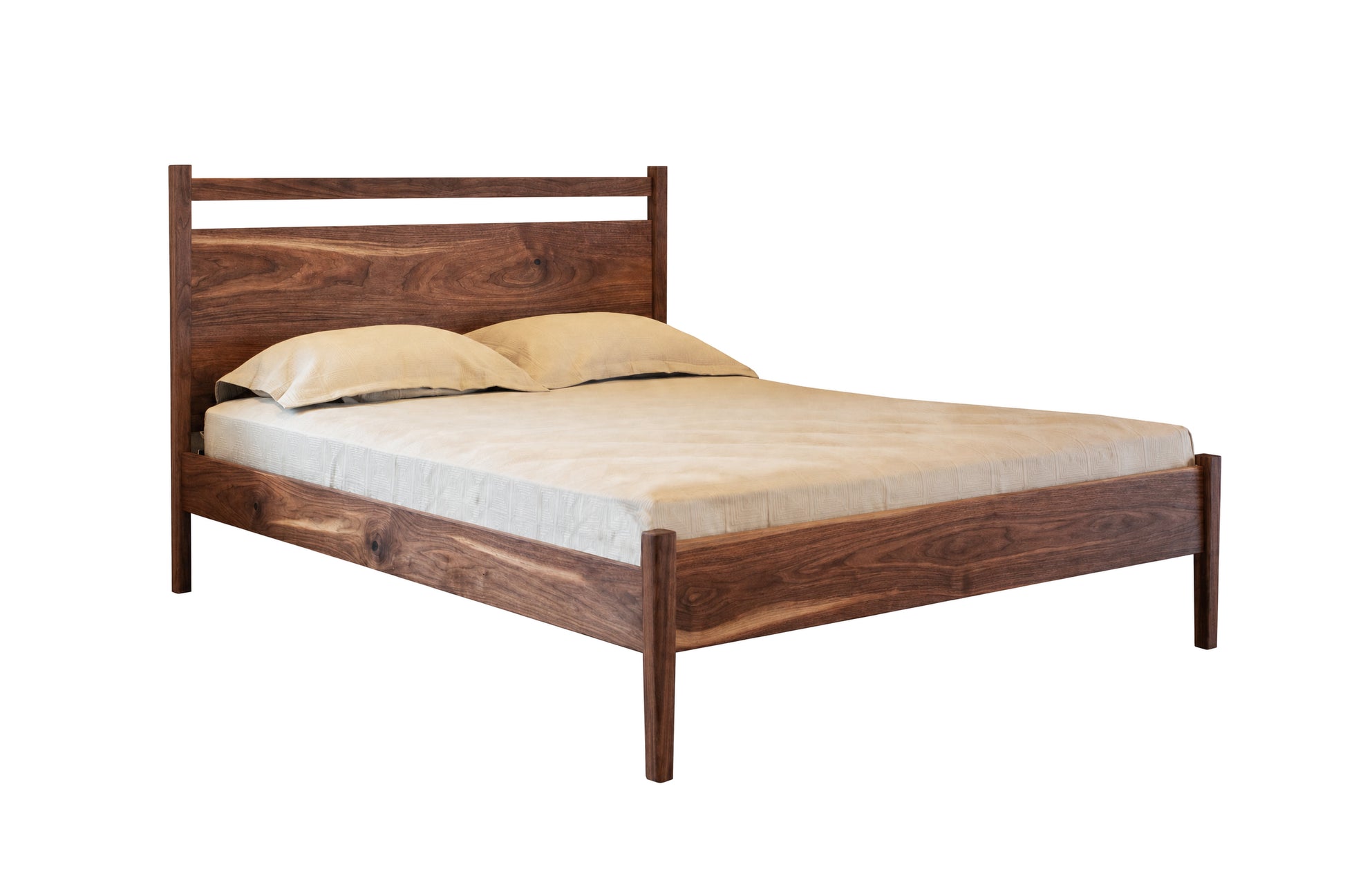 A dark Walnut wood bed frame with a matching headboard and footboard, shown with a mattress and two pillows on a plain white background.