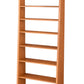 A tall, narrow wooden bookcase with eight shelves, shown at a slight angle on a plain white background.