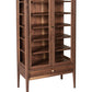 A tall wooden display cabinet with glass doors, multiple interior shelves, and a lower drawer, shown on a plain white background.