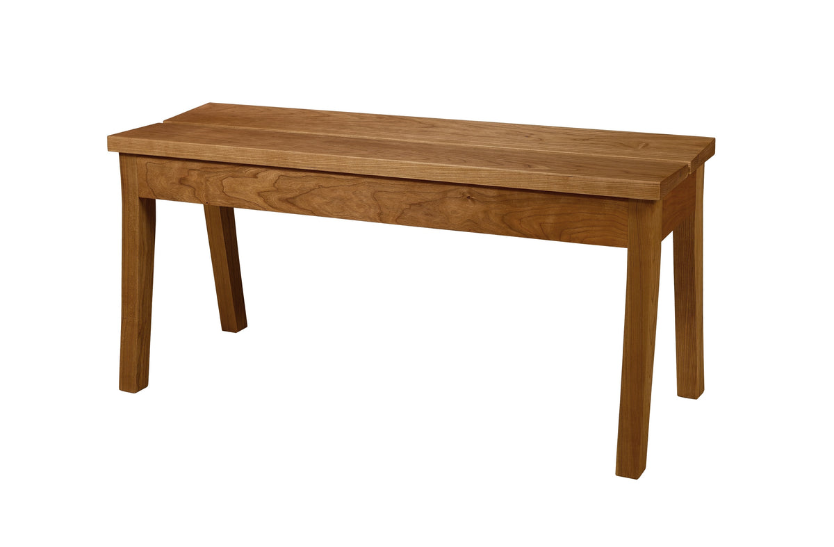 A wooden bench with a warm medium-brown finish, featuring a rectangular seat and four sturdy legs, shown against a plain white background.