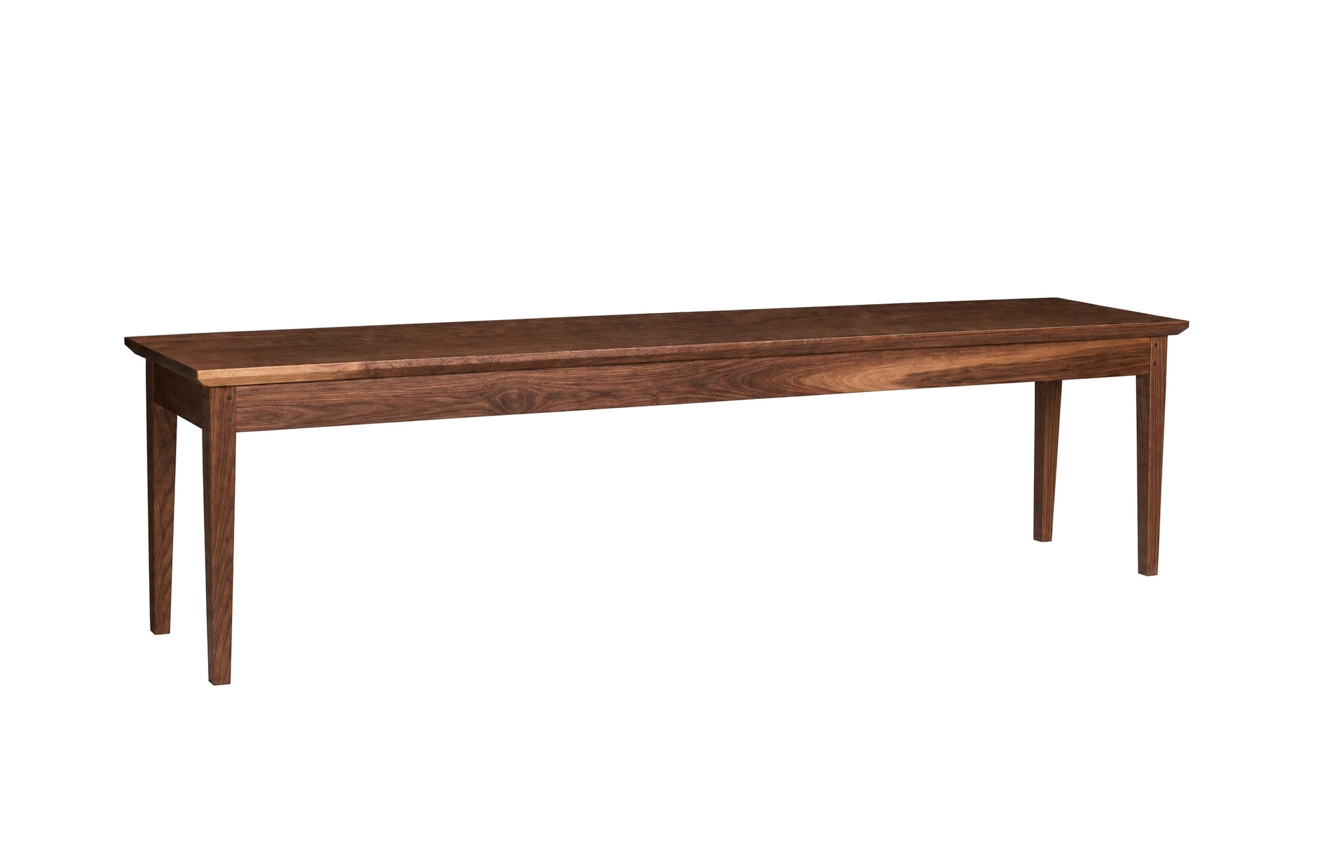 A long rectangular wooden bench with four legs, shown from a side angle on a plain white background.