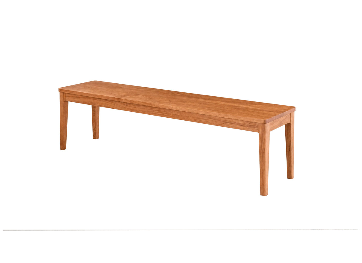 A long rectangular wooden bench with four legs, shown from a three-quarters angle on a plain white background.