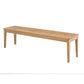 A light natural oak wood bench with a rectangular seat and four tapered legs, shown from a three-quarters perspective on a solid white background.