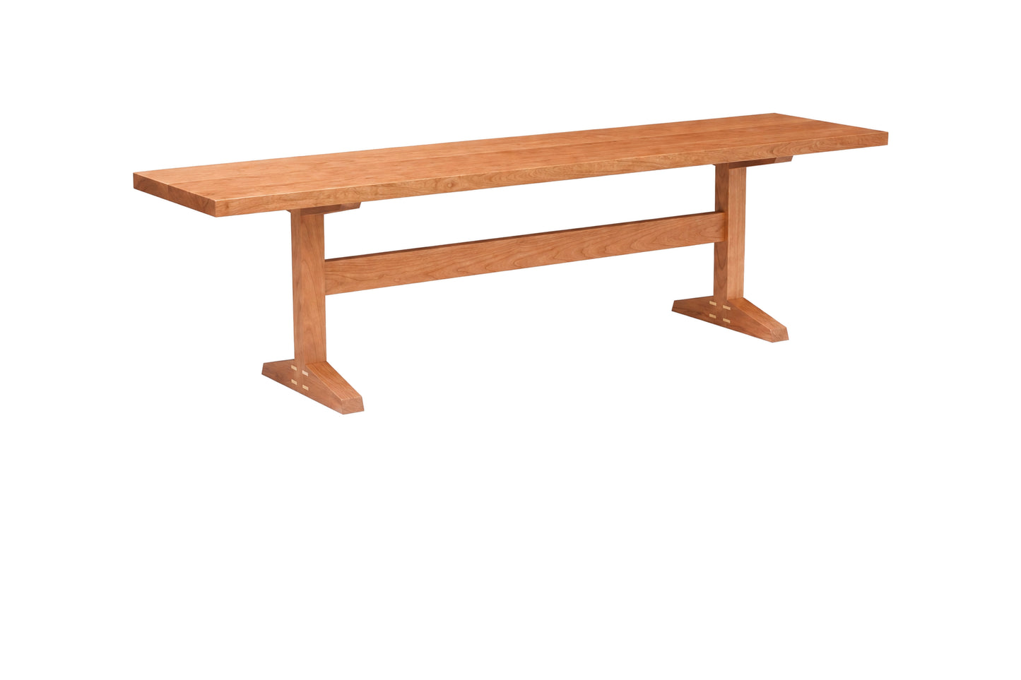 A rectangular wooden bench with a warm medium-brown finish, featuring a thick top, a central support beam, and angled legs with footrests, isolated on a white background.