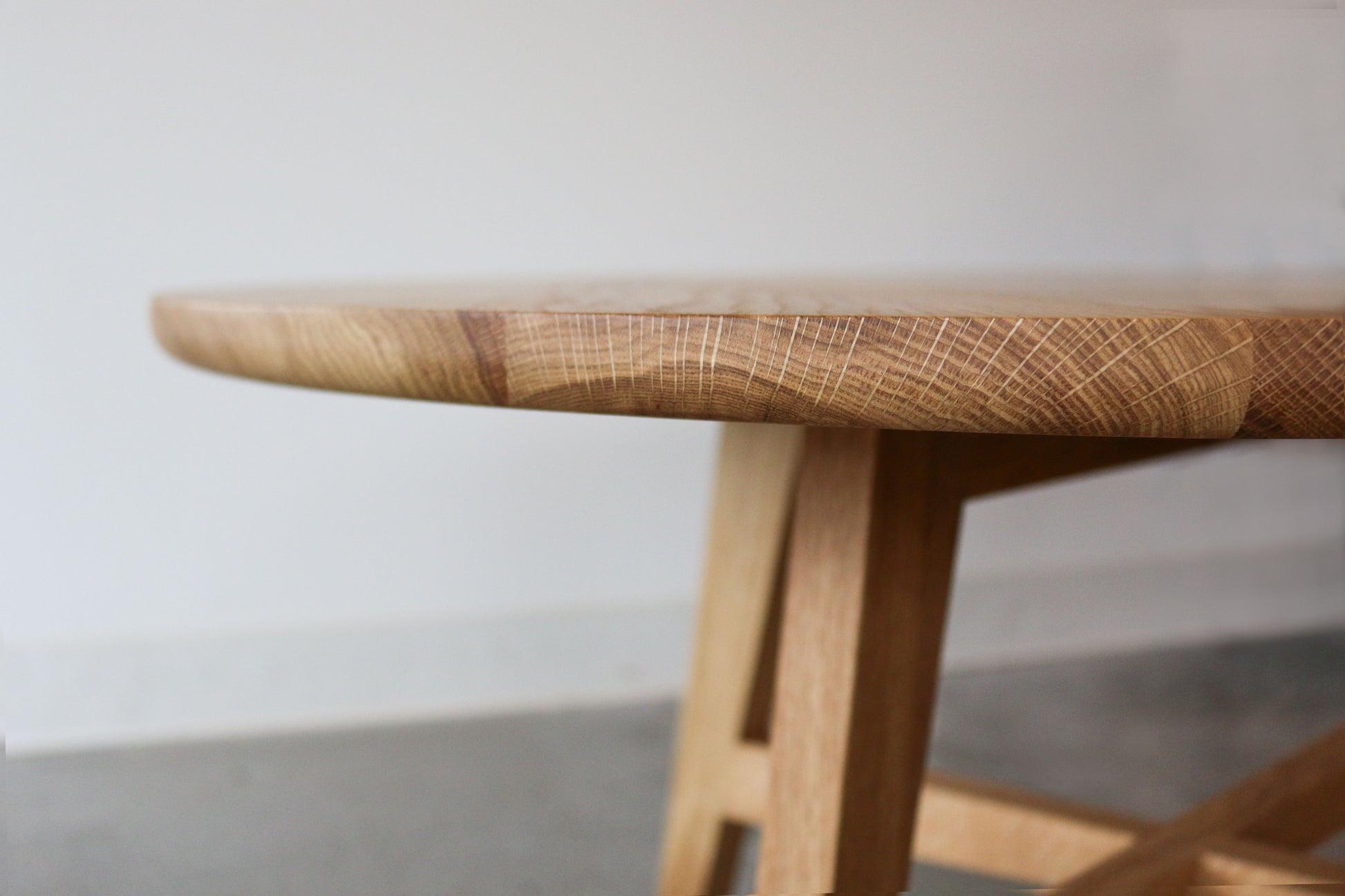 Edge detail of the Klamath Round Handcrafted Coffee Table in Oregon White Oak