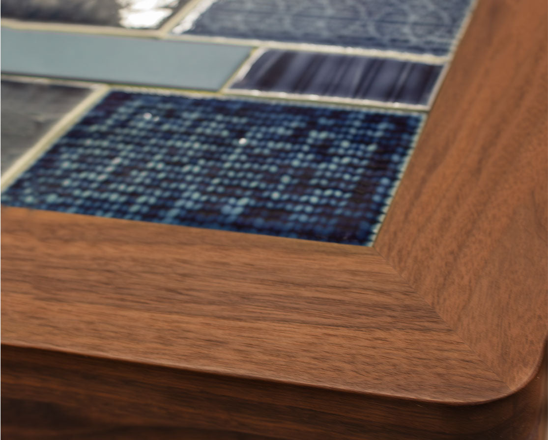 Close-up of a wooden frame with blue mosaic tiles