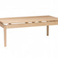 A light natural wood rectangular table, shown on a plain white background.