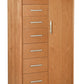 A tall wooden storage cabinet with seven drawers on the left and a single door on the right, finished in a light Cherry wood tone with silver metal handles.