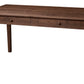A dark brown wooden writing desk with two drawers and round knobs, shown from a three-quarter angle on a white background.