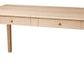 A light natural wood writing desk with two drawers and round wooden knobs, shown from a three-quarter angle on a white background.