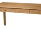 A light oak wood writing desk with two drawers and round wooden knobs, shown from a three-quarter angle on a white background.