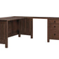 An L-shaped wooden desk with a three-drawer side cabinet, shown from a three-quarter angle on a solid white background.