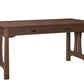 A wooden writing desk with a dark Walnut finish, featuring a single drawer with dark wood handles and decorative apron legs, shown on a solid white background.