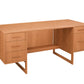 A mid-century modern wooden desk with a warm honey oak finish, featuring three drawers on the left, two drawers on the right, an open center shelf, and angled metal legs, shown on a solid white background.