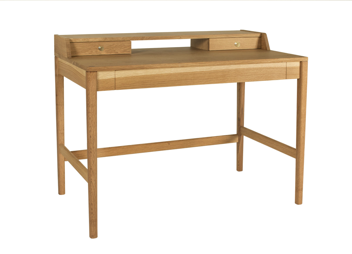 A light oak wood writing desk with a built-in shelf, two small drawers on the back panel, and a clean rectangular frame, shown on a solid white background.