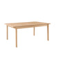 A light natural wood dining table with a rectangular top and four legs, shown on a plain white background.