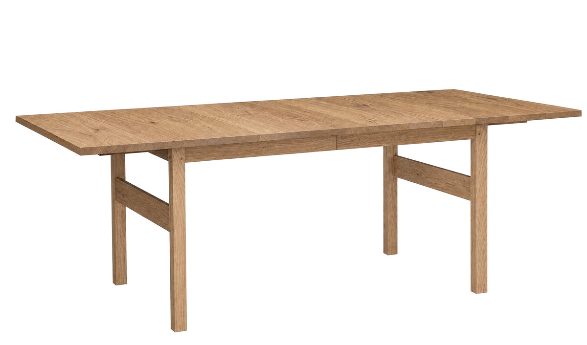 A light Oak wooden extendable dining table with a natural oak finish, shown from a three-quarter angle on a solid white background.