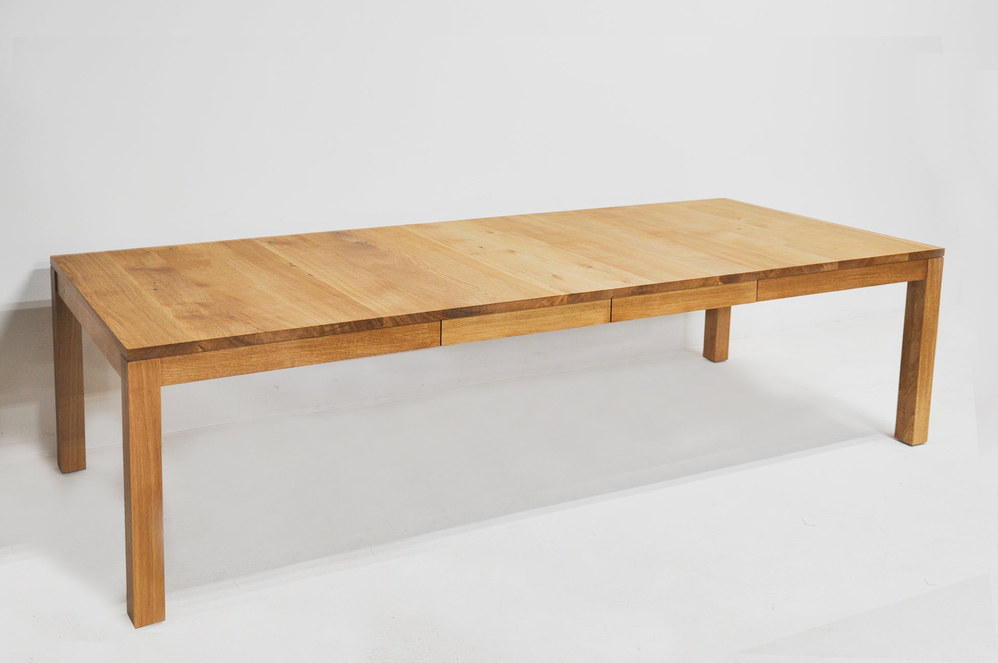 Wooden dining table on a white background