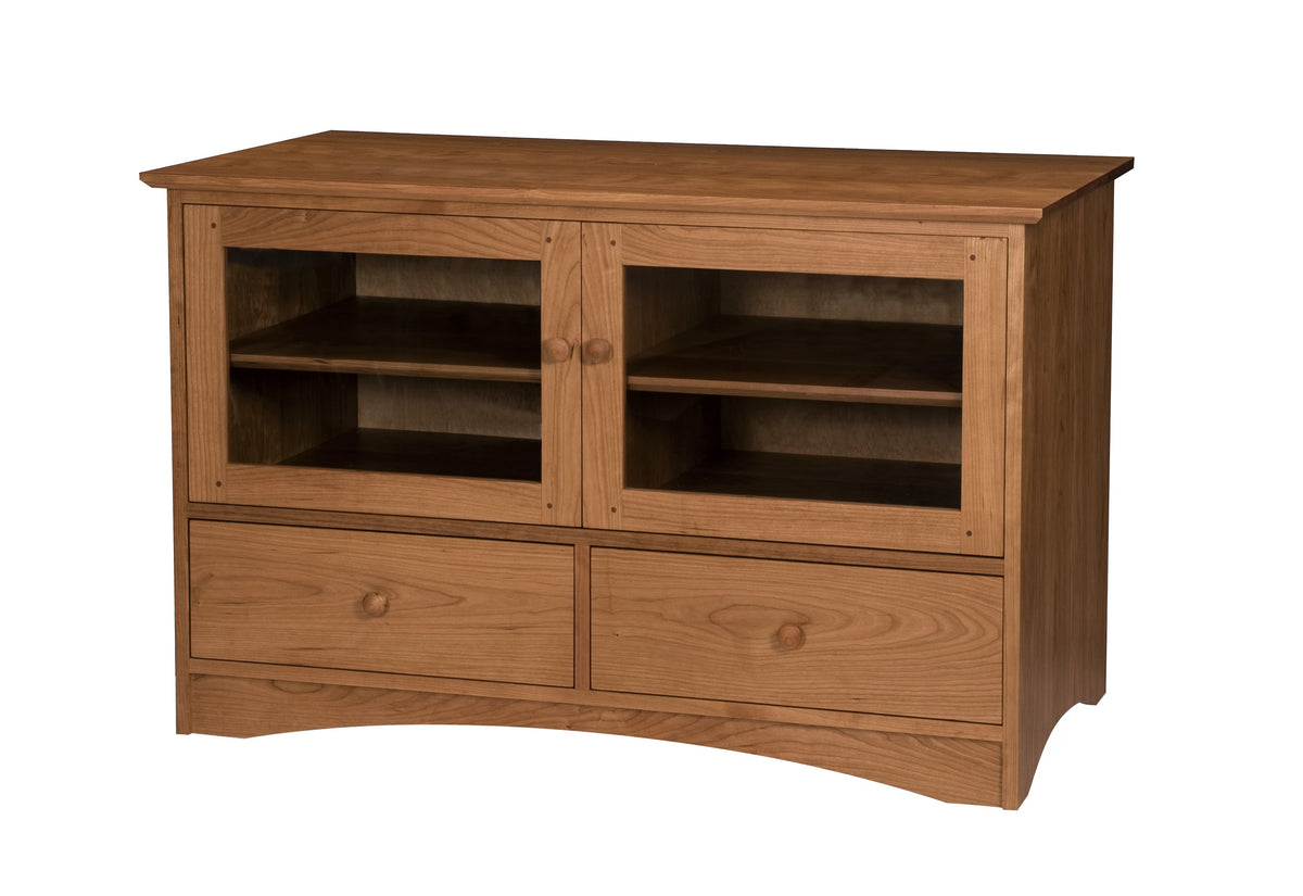 A medium Cherry wooden media console with two glass-front upper cabinets, two lower drawers, and curved front feet, shown on a plain white background.