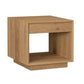 A modern square side table or end shelf made of light oak wood, featuring a single drawer on the top and an open cubby shelf below, shown on a plain white background.