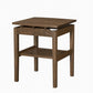 A wooden side table with a dark brown finish, features a lower shelf, and walnut risers under the tabletop, set against a plain white background.