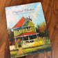 Book titled 'The Painted Kitchen' on a wooden surface