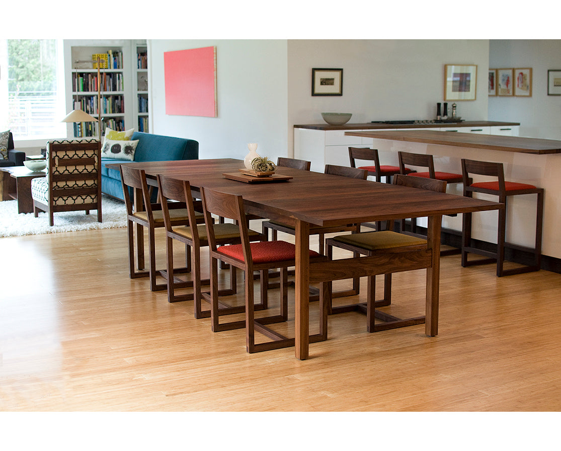 Celilo Dining Table in Eastern Walnut, shown with Celilo Chairs