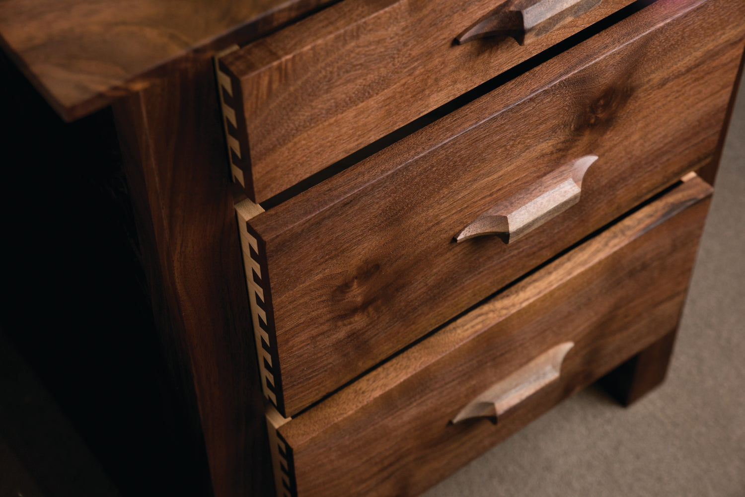 Detailed photo of Pacific 3 drawer nightstand made in Western Walnut by The Joinery