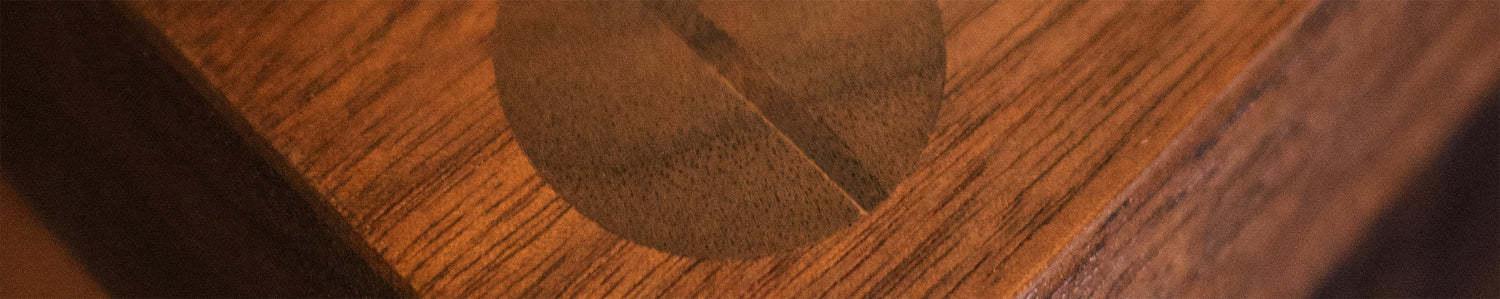 Close-up of a wooden surface with a circular inlay