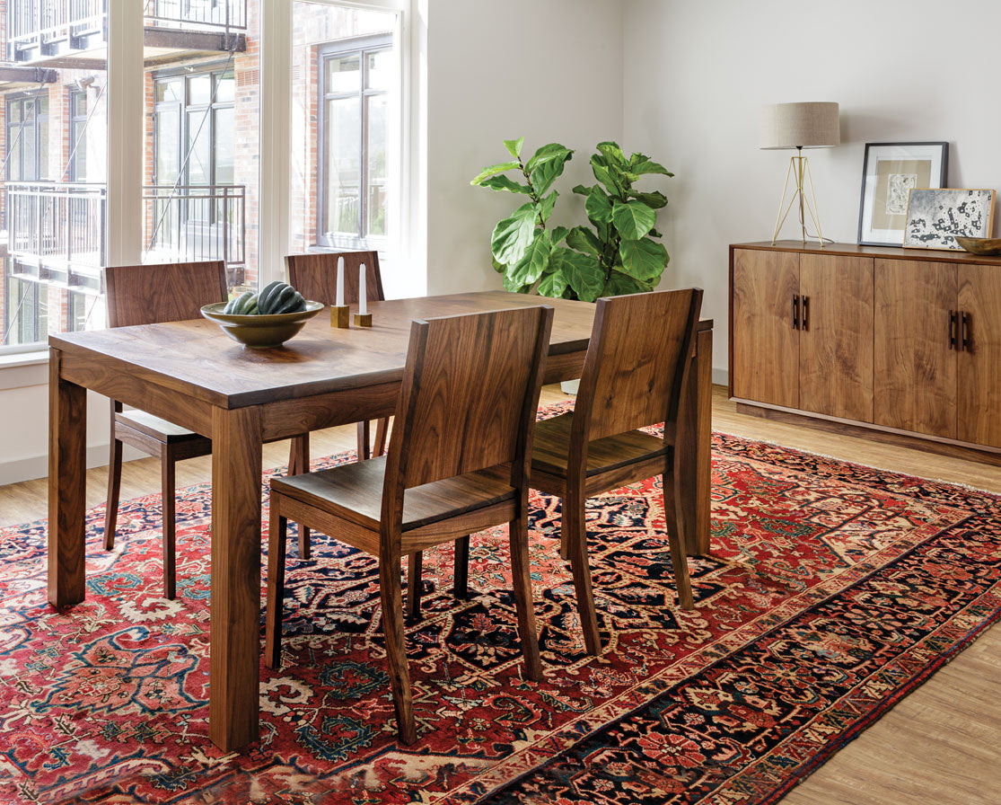 Studio Dining Table in Eastern Walnut with Studio Chairs and Modern Sideboard